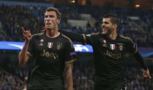 L'esultanza del croato insieme a Morata. Reuters